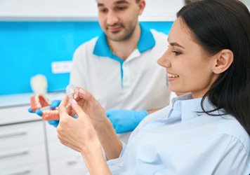 Your new dentures may take a few weeks to get used to, but soon they’ll feel just like real teeth