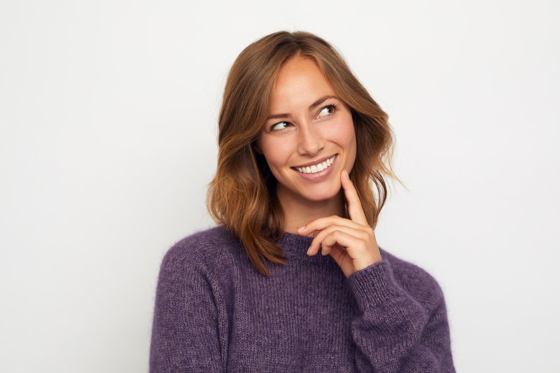 Patient smiling with dental implants